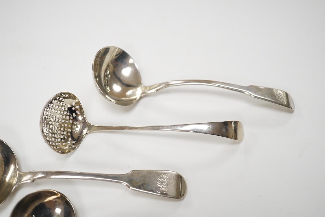 A pair of George IV silver fiddle pattern sauce ladles, by Charles Eley, London, 1826, 17cm, together with a George III silver fiddle pattern sauce ladle, London, 1806 and a George III silver Old English pattern sifter l